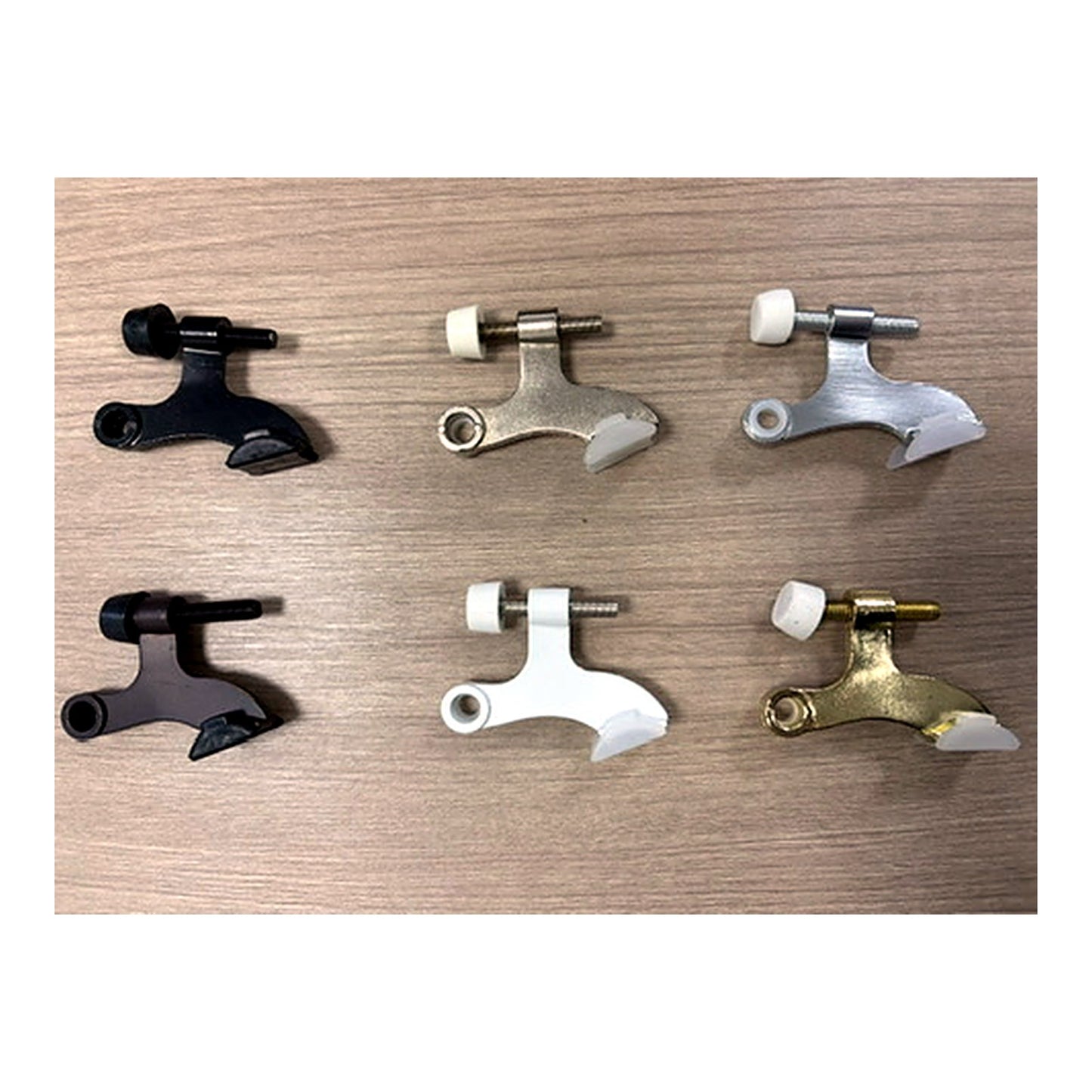 All five HingeStop finishes — satin nickel, matte black, white, oil-rubbed bronze, and polished brass door stoppers